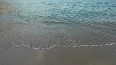Sea waves washing over sandy beach with crystal water. Stock Footage 332225897