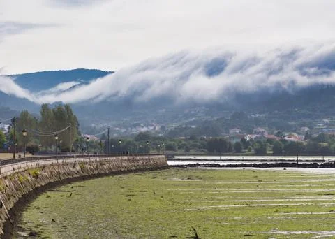A sea of white clouds going down the mountains to the village of Noia in Gali Stock Photos