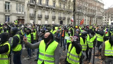 Sea of yellow vests protesters singing together during demonstration in France Stock Footage 103183214