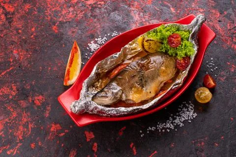 Seabass in foil Stock Photos