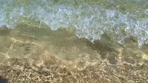 Seabed in shallow water. wave running onto sandy shore. Stock Footage 265705114