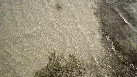Seabed, top view, small waves roll ashore Stock Footage 120709998