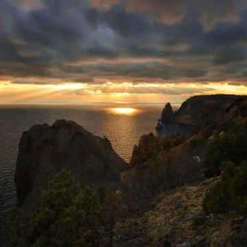 Seacoast with cliffs at sunset Stock Photos