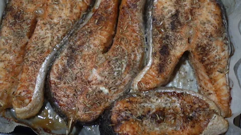 Seafood. Baked salmon on a baking sheet. Close-up. Stock Footage 281341508