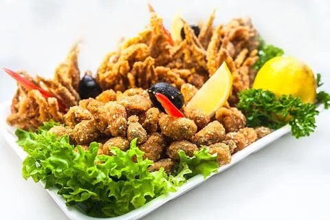 Seafood in battered with lemon Stock Photos