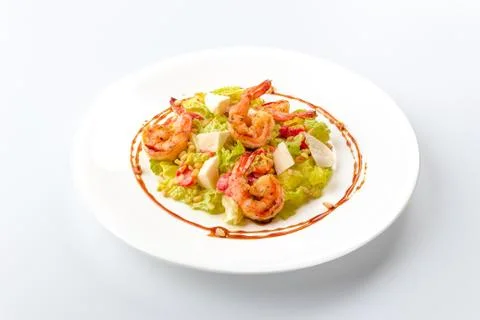 Seafood Caesar salad with prawns, rocket leaves, cherry tomatoes and parmesan Stock Photos