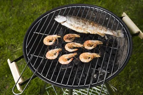 Seafood on grill Stock Photos