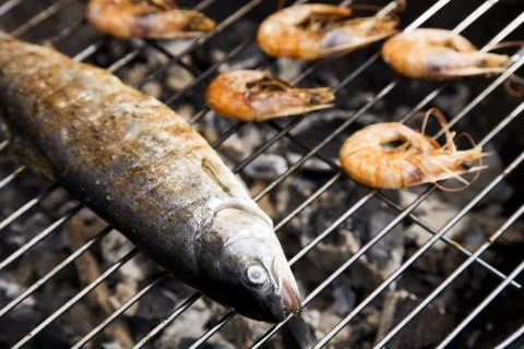 Seafood on grill Stock Photos