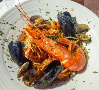 Seafood pasta with langoustine and mussels Stock Photos