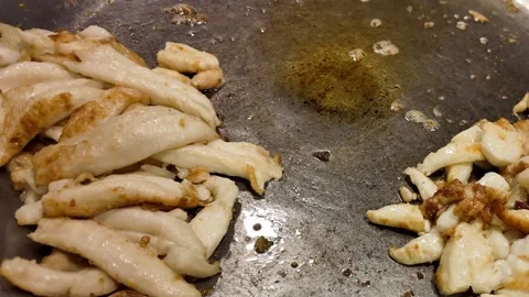 Seafood Pieces Frying on a Large Flat Griddle at a Thai Food Market 스톡 동영상 342501045