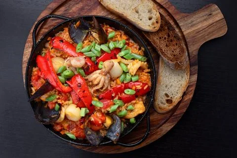 Seafood risotto with bread served Stock Photos