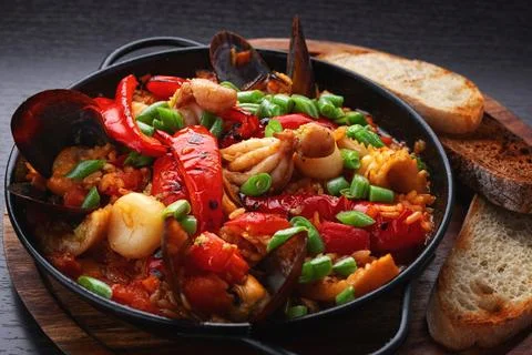 Seafood risotto with bread served Stock Photos