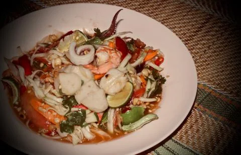 Seafood salad on a plate on the table. Stock Photos