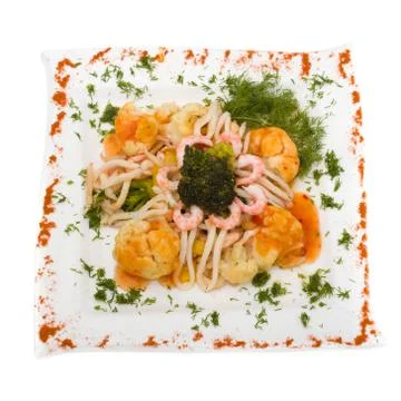 Seafood salad with squid and fresh vegetable, isolated on white Stock Photos