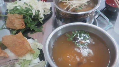 Seafood soup in the dining table Stock Footage 70614097