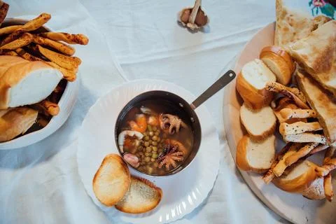 Seafood soup made with bread in kitchen Стоковые фото