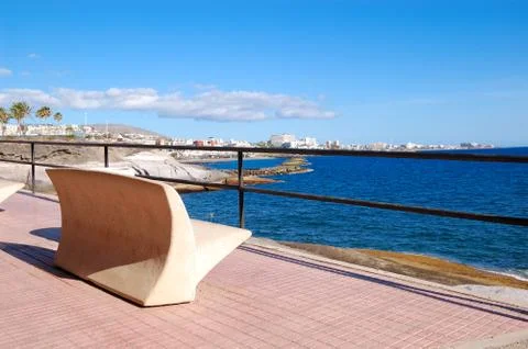 Seafront and bench at playa de las américas, tenerife island, spain Foto stock