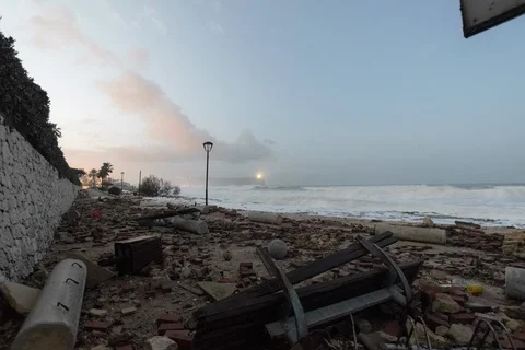 Seafront Destroyed After Massive Storm With Lighthouse Stock Footage 123602344