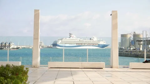 Seafront promenade with a ferry in the background behind a glass window. Stock Footage 106338231