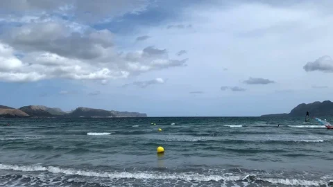 Seafront with surfers on the island of Mallorca Stock Footage 114544136