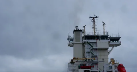 Seagull circles above ship superstructure under blue haze Stock-Footage 321774593