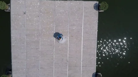 Seagull flies over the river with a pontoon Stockbeeldmateriaal 70853841