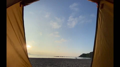 A seagull fly over under the sunset outside a tent Stock Footage 136714686