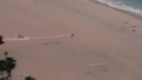 Seagull Flying in Front of Drone Over Coastal Promenade in Spain Stock Footage 346022383