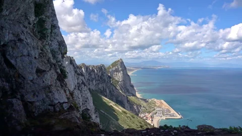 Seagull flying next to the Rock of Gibraltar Stock Footage 336615231