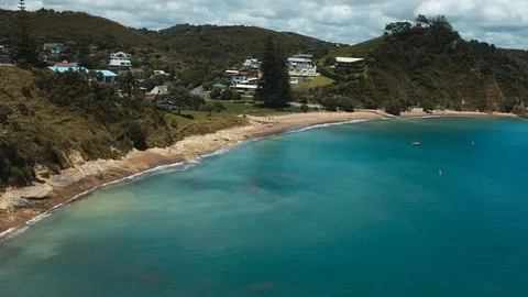 Seagull flying point of view towards sunny beach in New Zealand Stock Footage 90268849