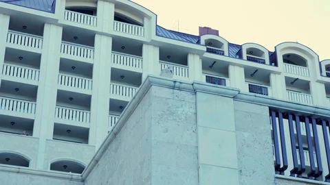 Seagull standing over a hotel next to the sea Stock Footage 83658437