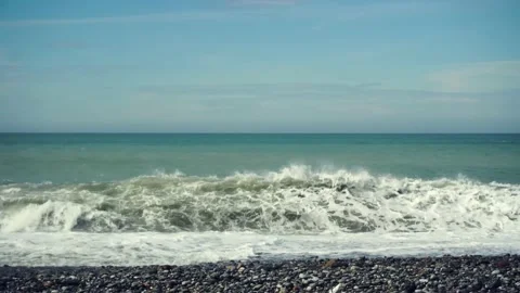Seagulls fly low over the waves Stock Footage 148072092