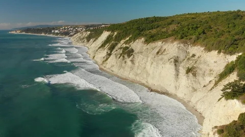 Seagulls fly over the waves during a storm. Aerial drone view Stock Footage 96386906