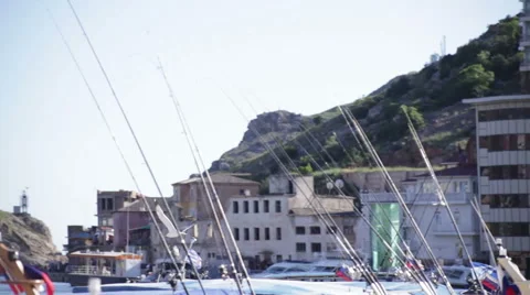 Seagulls flying over the bay in the background of mountains with hotels. Stock Footage 52979514