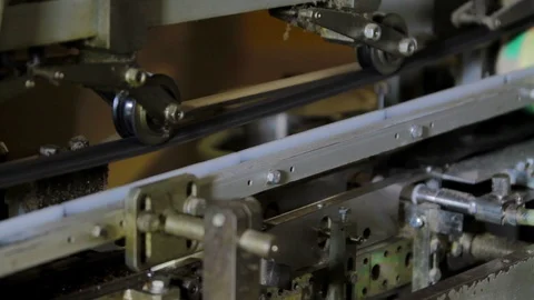 Sealed tin cans with meat are moving further along the conveyor Stock Footage 94155662