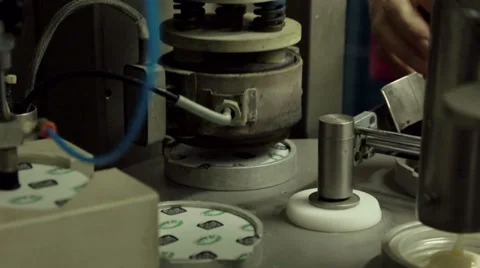 Sealing cups with tin lids Stock Footage 36194089