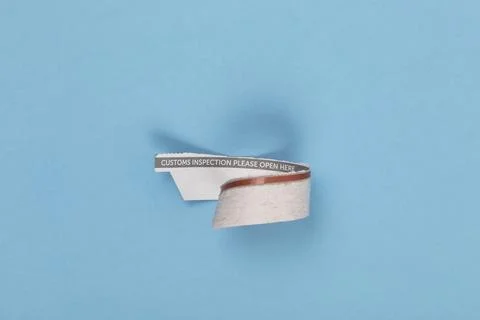 Sealing part of an envelope post saying customs inspection, please open here. 스톡 사진