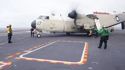Seamen prepare C-2 Greyhound for take off Stock Footage 111849043