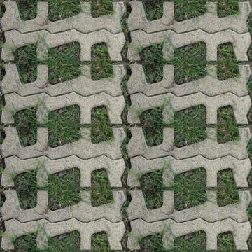 Seamles pattern of concrete road tile on the green grass path Stock Photos
