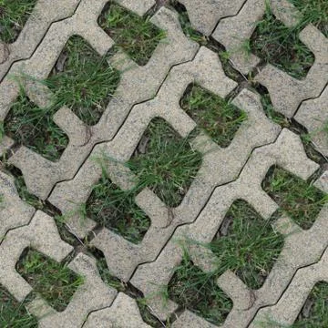 Seamles pattern of concrete road tile on the green grass path Stock Photos
