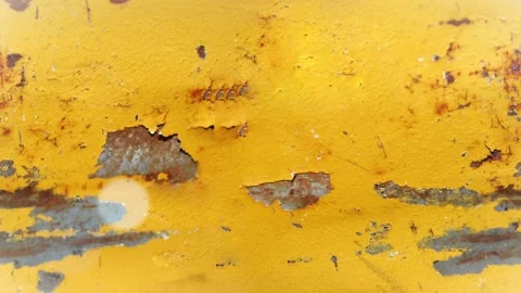 Seamless 4K looping vertical movement across weathered yellow painted metal with 스톡 동영상 344119822