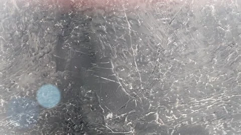 Seamless 4K looping vertical movement across a dark scratched metal surface with Stockbeeldmateriaal 344120870