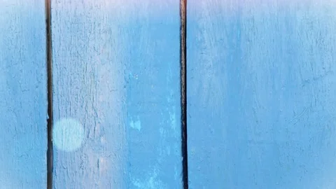 Seamless 4K looping vertical movement over a blue painted wall with a dark Stock Footage 344121351