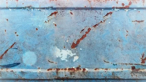Seamless 4K looping vertical movement across a weathered blue painted metal Video stock 344121354