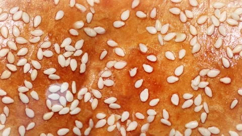 Seamless 4K looping vertical movement across a golden baked bread crust with Stock-Footage 344122642