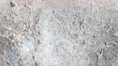 Seamless 4K looping vertical movement across a rough light concrete surface with 動画素材 344122755