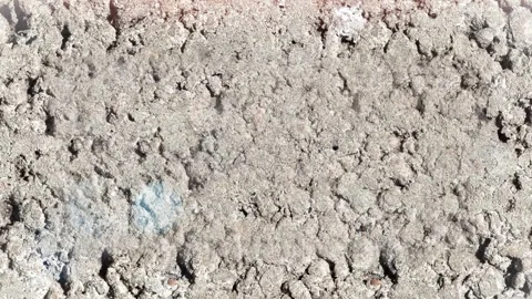 Seamless 4K looping vertical movement across a cracked rocky ground texture with Stock Footage 344122897
