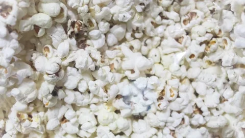 Seamless 4K looping vertical movement across fresh white popcorn creating a fun 動画素材 344124982