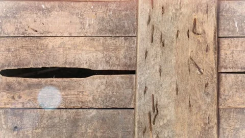 Seamless 4K looping vertical movement over aged wooden boards with visible crack 動画素材 344125109