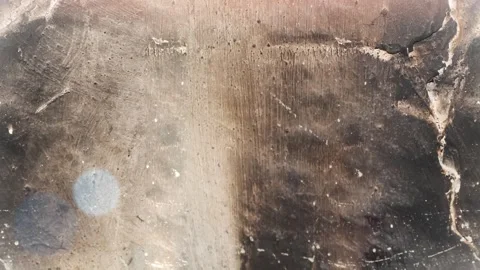 Seamless 4K looping vertical movement across a dark cracked stone surface with Stockbeeldmateriaal 344125181